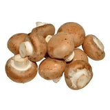 Fresh organic chestnut mushrooms with brown textured caps and white stems perfect for cooking and recipes