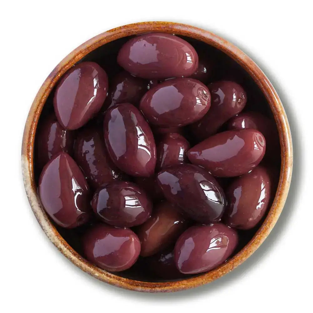 A bowl of glossy dark purple organic kalamata whole olives in a rustic brown ceramic dish not stuffed green olives