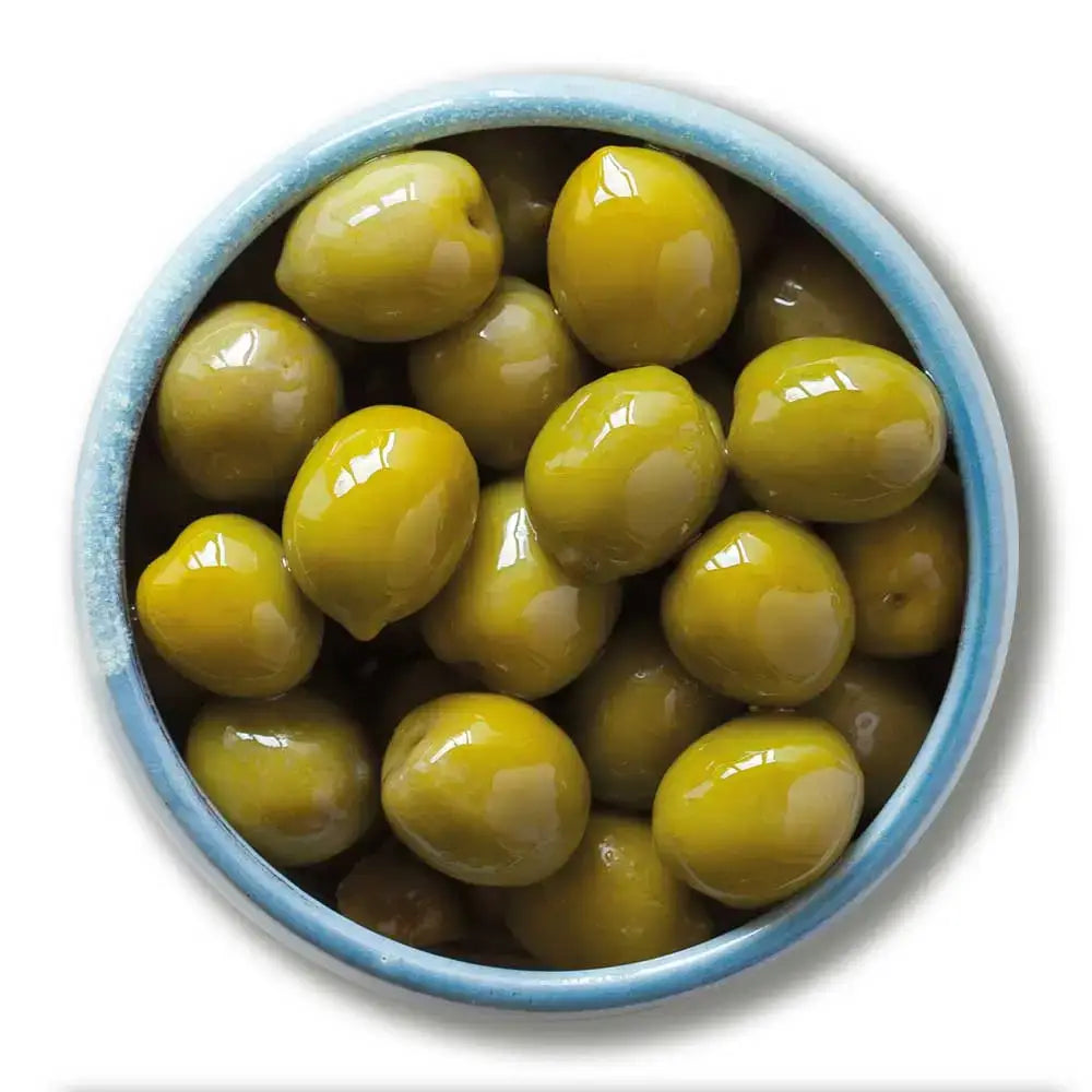 A bowl of glossy nocellara del belice green olives in a light blue ceramic dish perfect for del phi stuffed green recipes