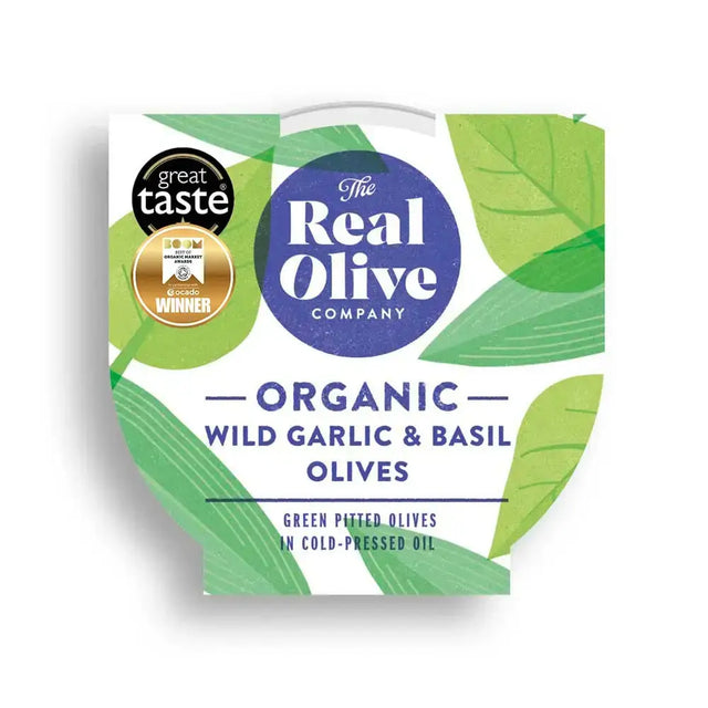 The real olive company organic wild garlic and basil pitted green olives in a white and green leaf patterned container