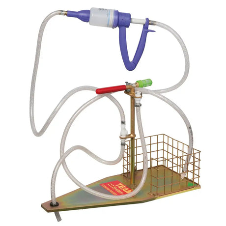 Osmonds gold fleece sheep dip dispenser with purple and white handheld vacuum pump on brass stand with wire basket