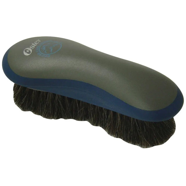 Oster hair finishing brush with dark green and blue ergonomic handle and dense black horse hair bristles for grooming