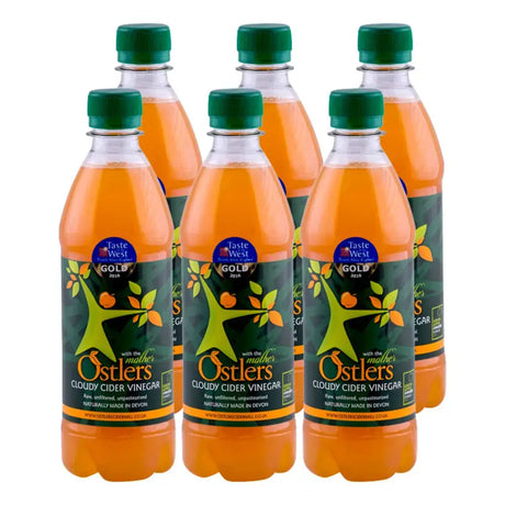 Six clear plastic bottles of ostlers cider organic cider vinegar with mother featuring green caps and orange tree labels from north devon