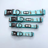 Set of four aqua-blue adjustable lovely dog collars with brown otter prints and pup chic bone-shaped tags