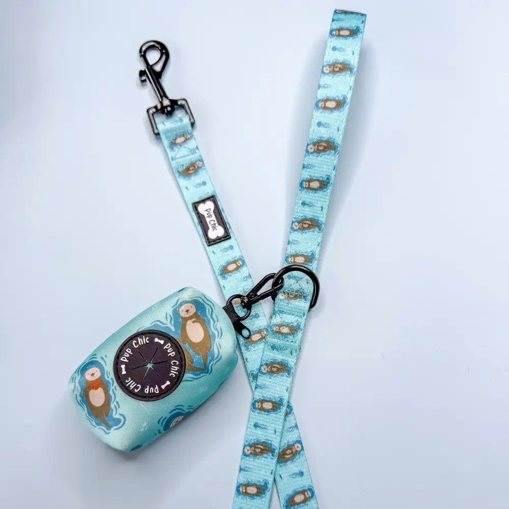 Light blue patterned otterly lovely poo bag holder and leash by pup chic for stress-free cleanups and easy access