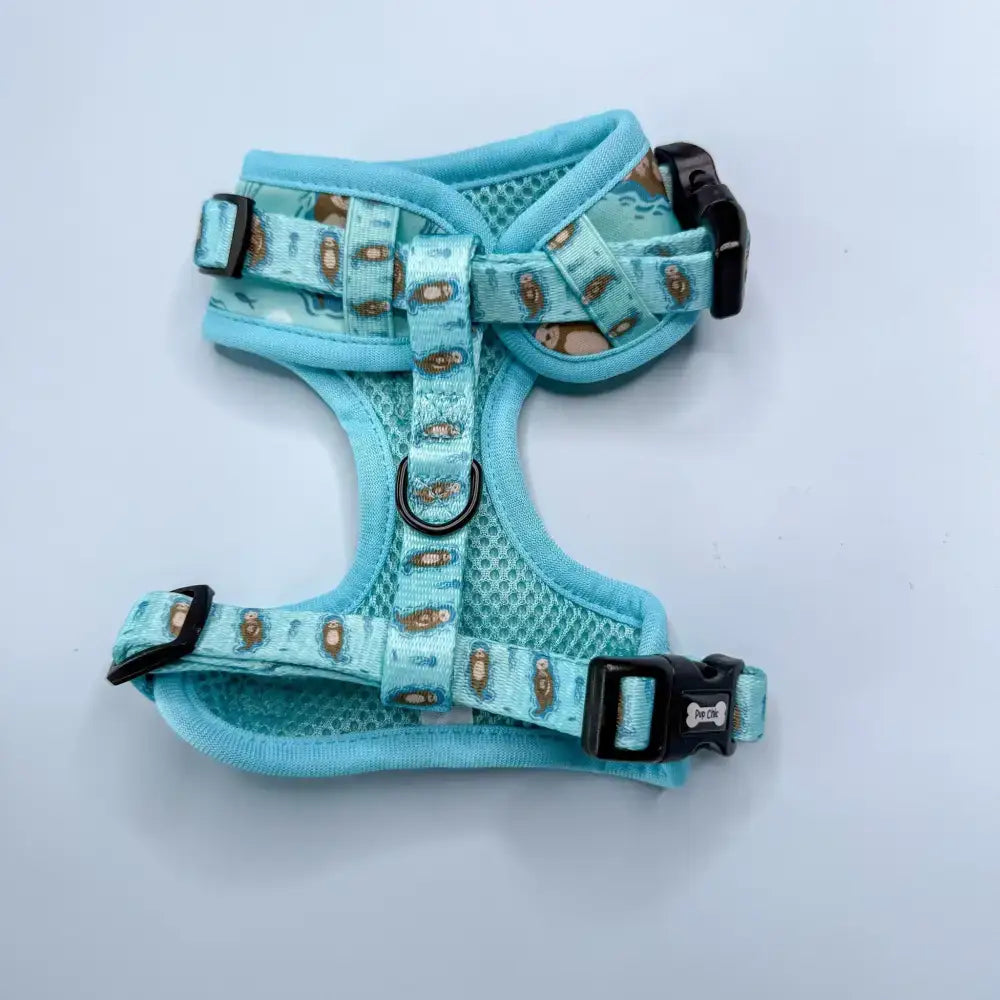 Light blue mesh otterly lovely step-in dog harness with sea otter print and black plastic buckles for pup chic style