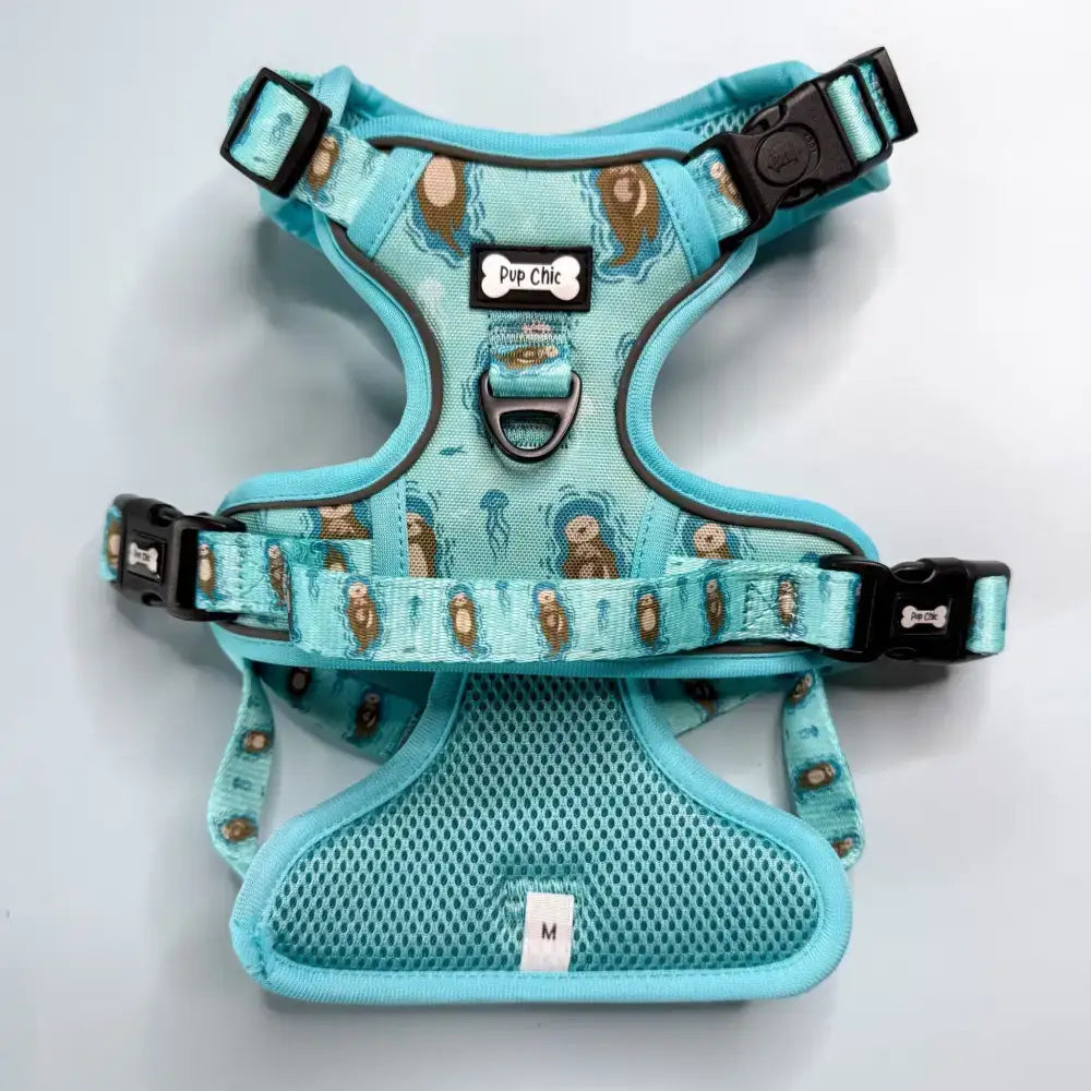 Turquoise otterly lovely tactical dog harness with playful otter jellyfish pattern mesh padding and black buckles for close control busy areas