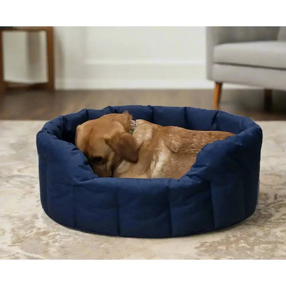 Navy blue quilted heavy duty oval dog bed with plush cushioned interior from p and l country dog tough waterproof dog line