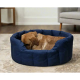 Navy blue quilted heavy duty oval dog bed with plush cushioned interior from p and l country dog tough waterproof dog line