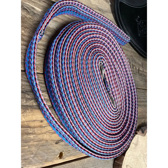 A coiled padded lunge line 8m in vibrant blue and pink braided design perfect for windsor padded lunge use