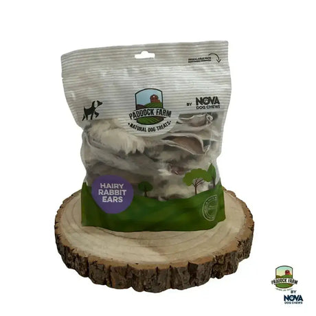 A clear pouch of paddock farm hairy rabbit ears dog treats showing natural textured farm hairy rabbit chews inside