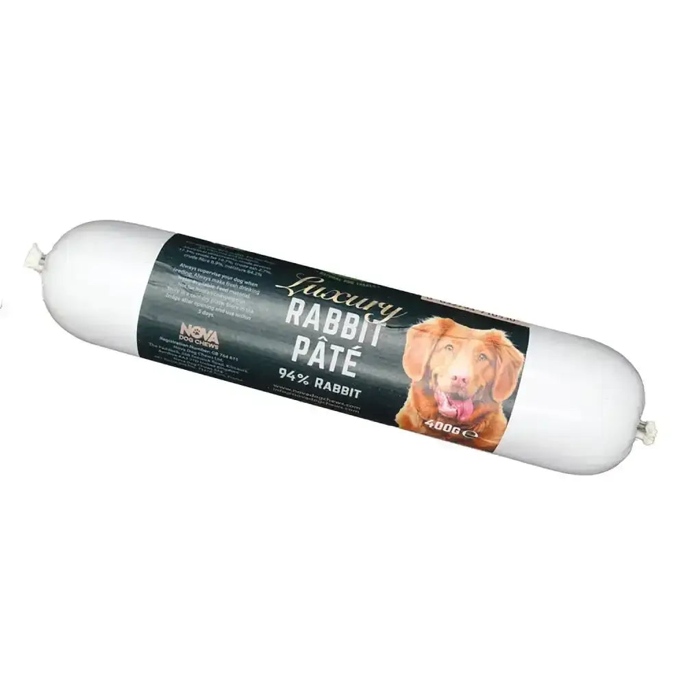 A 400g white cylinder of paddock farm luxury rabbit pâté with a dark label featuring a golden retriever image