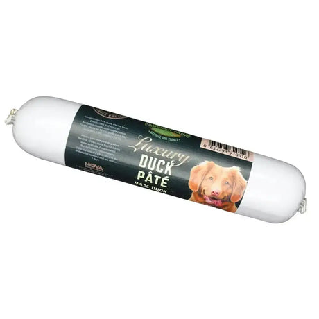 A white cylindrical package of paddock farm luxury duck pâté dog treats with a black label and golden retriever image