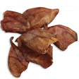 Dried brown leathery squid tentacles showing natural folds on the back side of paddock farm pig ears product