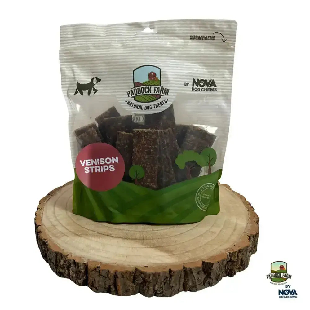 A clear plastic bag of paddock farm strips venison chews with a green and white label and red flavor accent