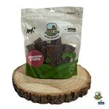 A clear plastic bag of paddock farm strips venison chews with a green and white label and red flavor accent