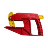 Red and yellow plastic parallax grabbit tool with serrated cutting edge for precise cuts in stable accessories setup