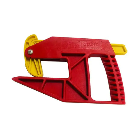 Red and yellow plastic parallax grabbit tool with serrated cutting edge for precise cuts in stable accessories setup
