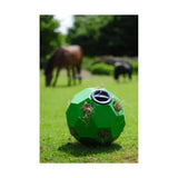 Bright green parallax hay play spherical shaped slow forage feeder with black opening and straw-filled indentations