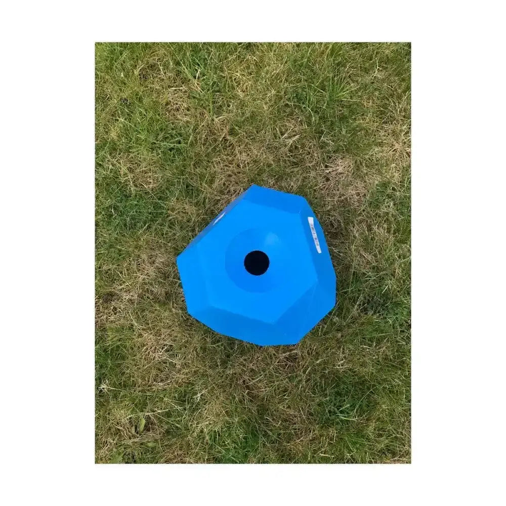 Bright blue hexagonal plastic balance disc with central hole from parallax snack for multi sided feeding fun