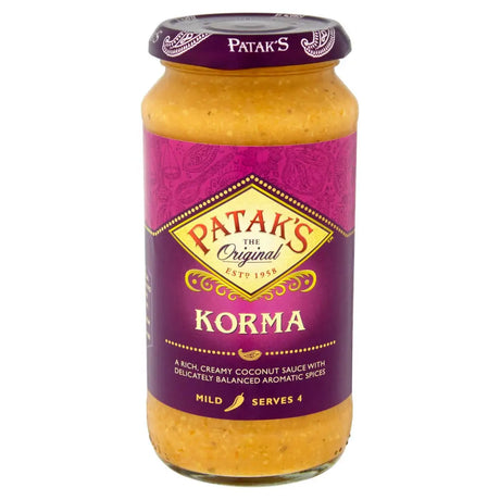 A glass jar of patak korma sauce 450g with rich creamy coconut sauce and aromatic spices for easy cooking