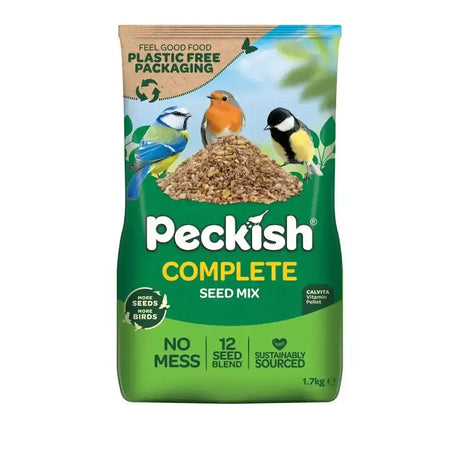 Green and blue peckish complete seed mix bag with three birds perched on a pile of seeds showing peckish complete benefits