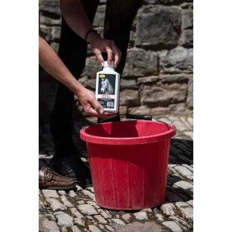 White bottle of peppermint splosh wash horse wash with black and white label featuring horse for horse grooming