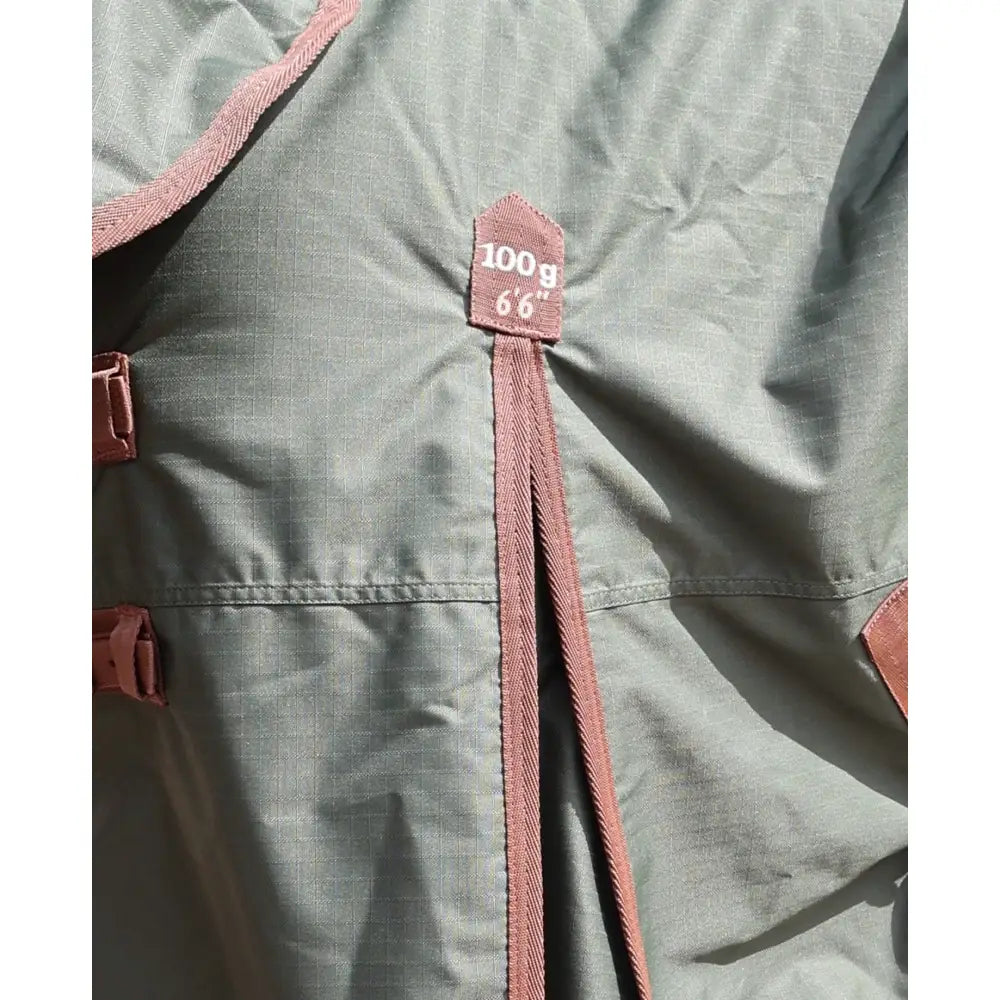 A dusty rose drawstring with 100g 6’6 tag on olive green perf combo 100g lightweight turnout rug for horses