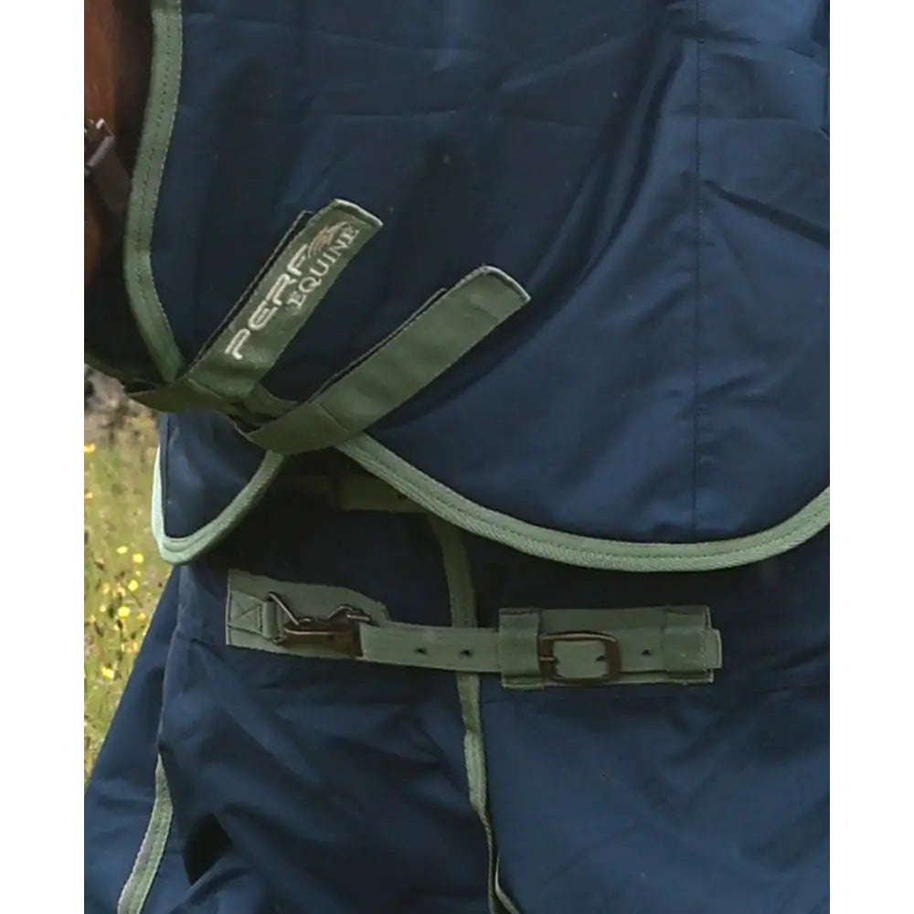 Dark blue turnout rug with olive trim and adjustable straps featuring perf detachable neck 300g heavy weight label