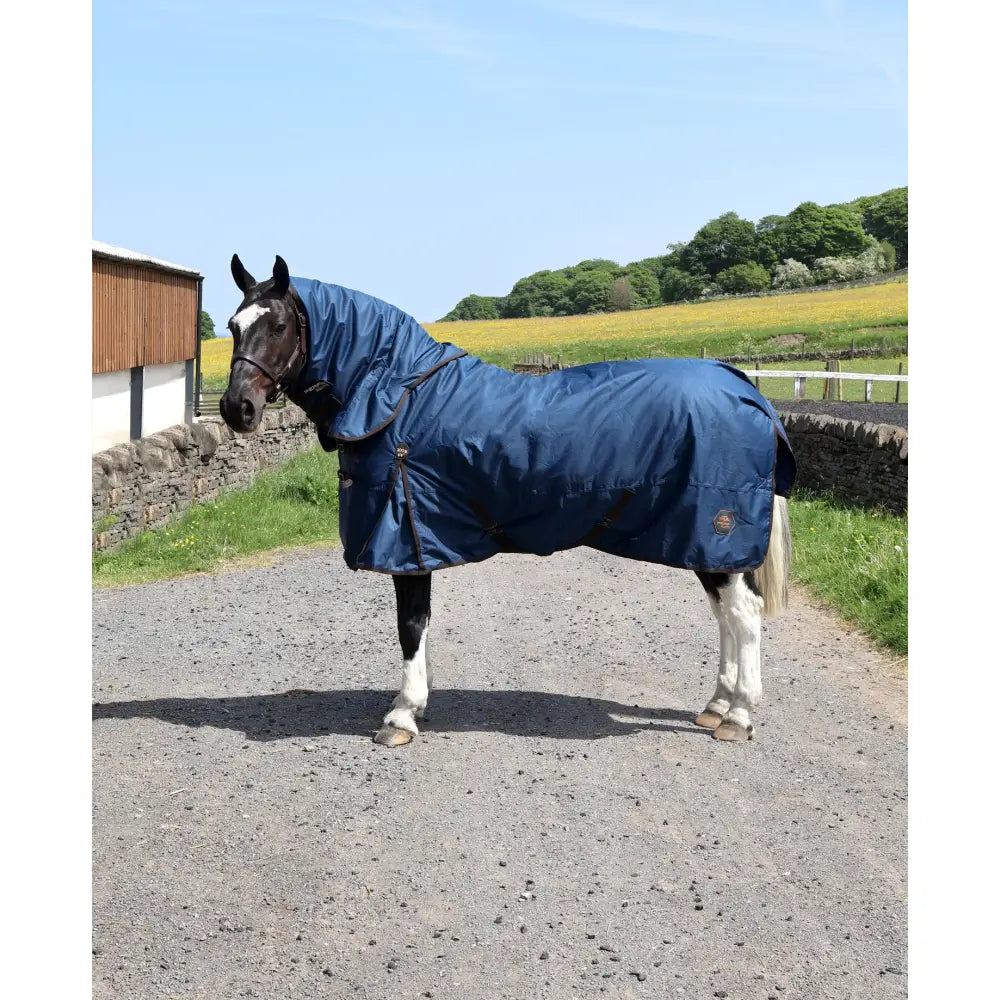 Navy blue perf detachable neck turnout rug with hood and black straps featuring a small circular logo on the side