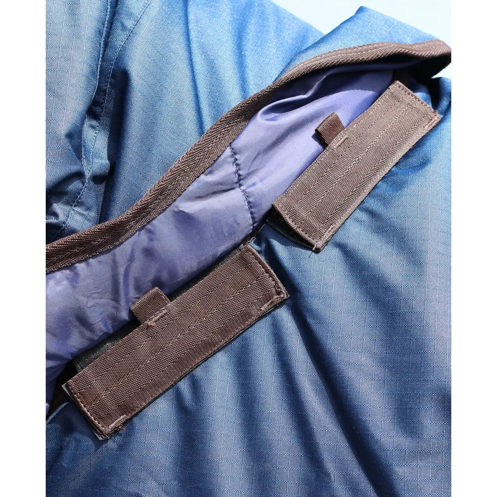Blue nylon perf detachable neck turnout rug with brown straps and purple lining for horses medium weight
