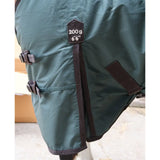 Dark green perf detachable neck turnout rug with black straps 200g weight and 6 6 length for horses