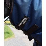 Blue perf turnout rug with black straps and branded label featuring a perf detachable neck for horses