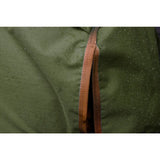 A brown textured zipper on dark green water-resistant fabric of the perf standard 0g lightweight turnout rug for horses