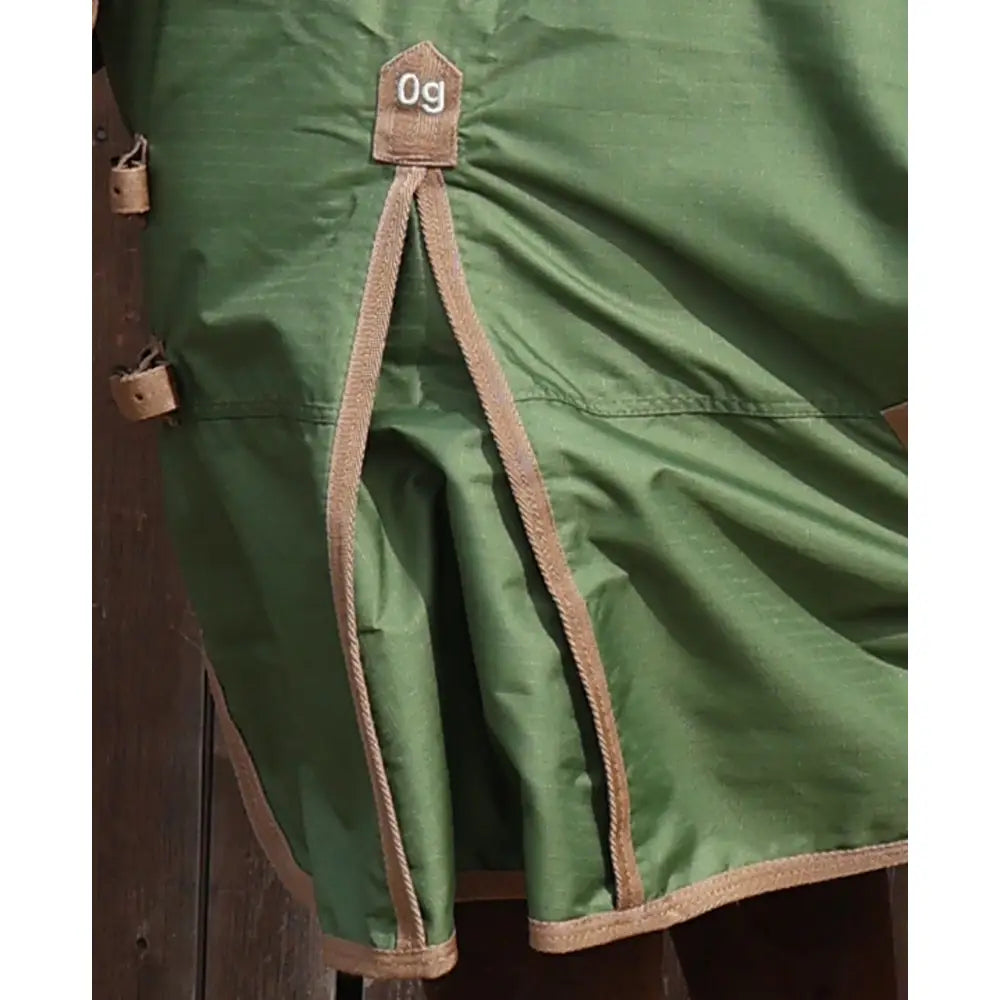 Green standard 0g lightweight turnout rug for horses with tan stitching and a small brown 0g tag at the top