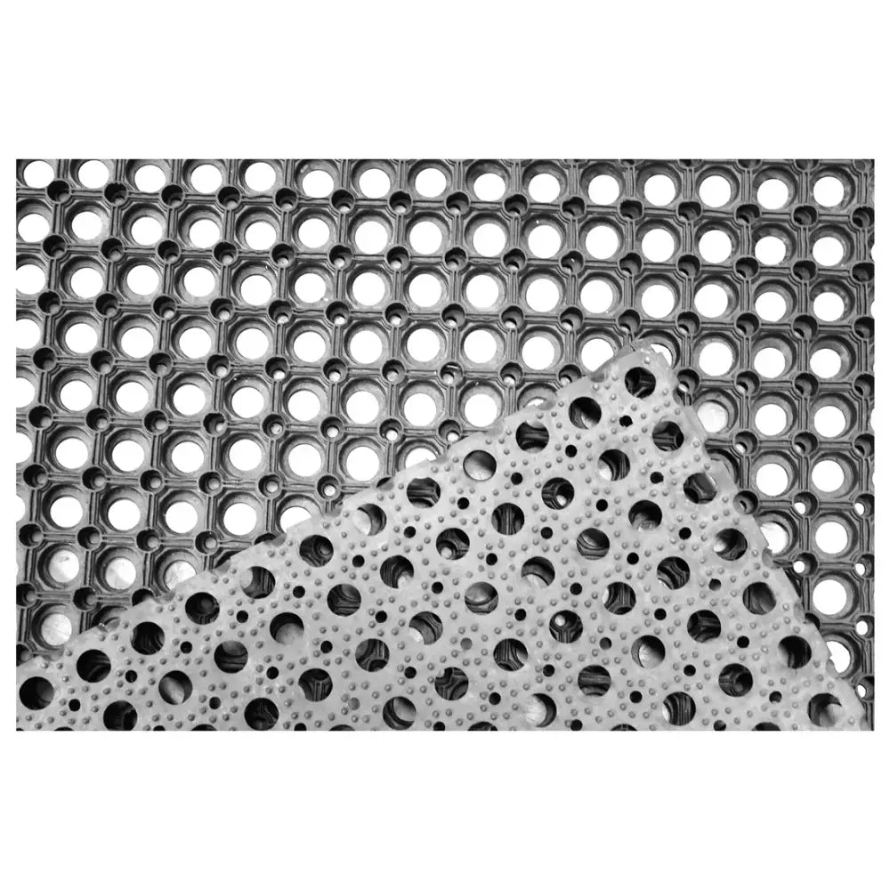 Gray perry equestrian rubber grass matting with hollow openings and raised dots ideal for wash-down areas