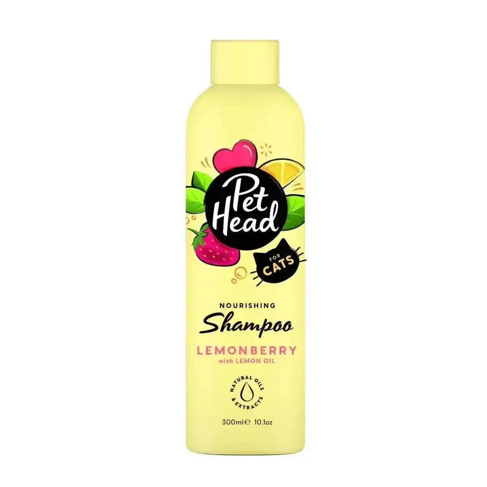 A pale yellow pet head cat nourishing shampoo bottle with a playful lemonberry label for cuddle buddy’s fur care