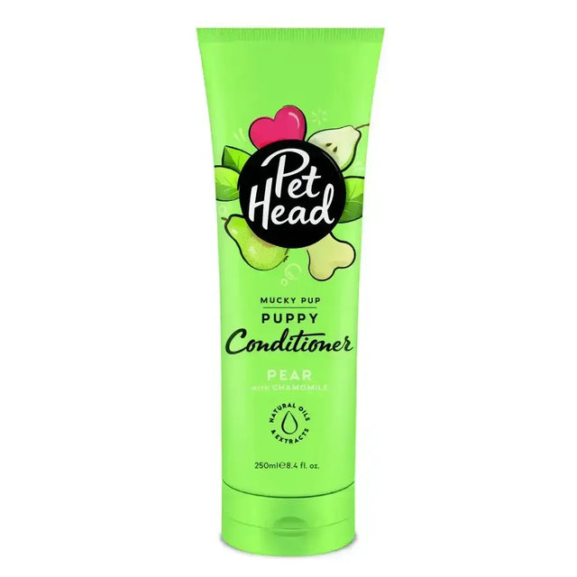 Bright green tube of pet head mucky puppy conditioner with pear and chamomile scent for gentle puppy care