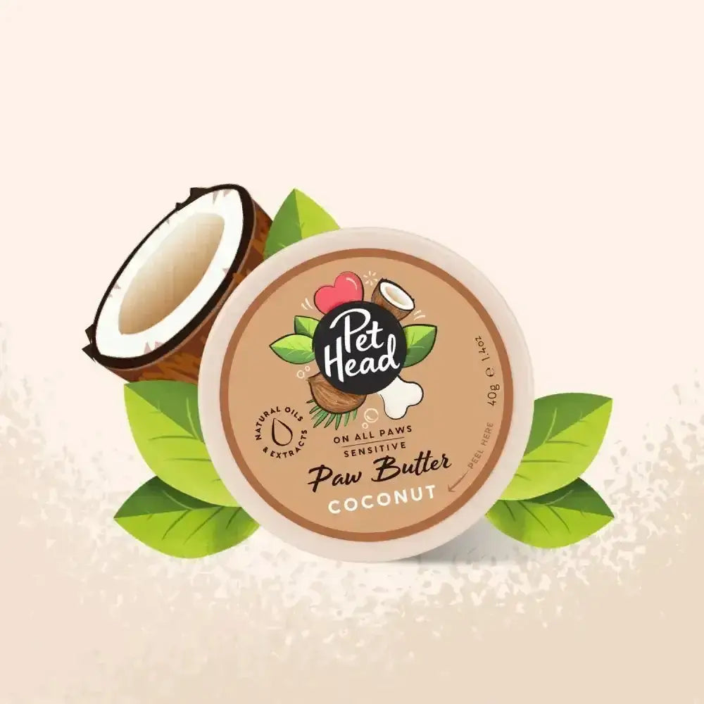 Pet head On All Paws coconut paw butter in a beige container with green leaf and coconut illustrations for pooch buttered care