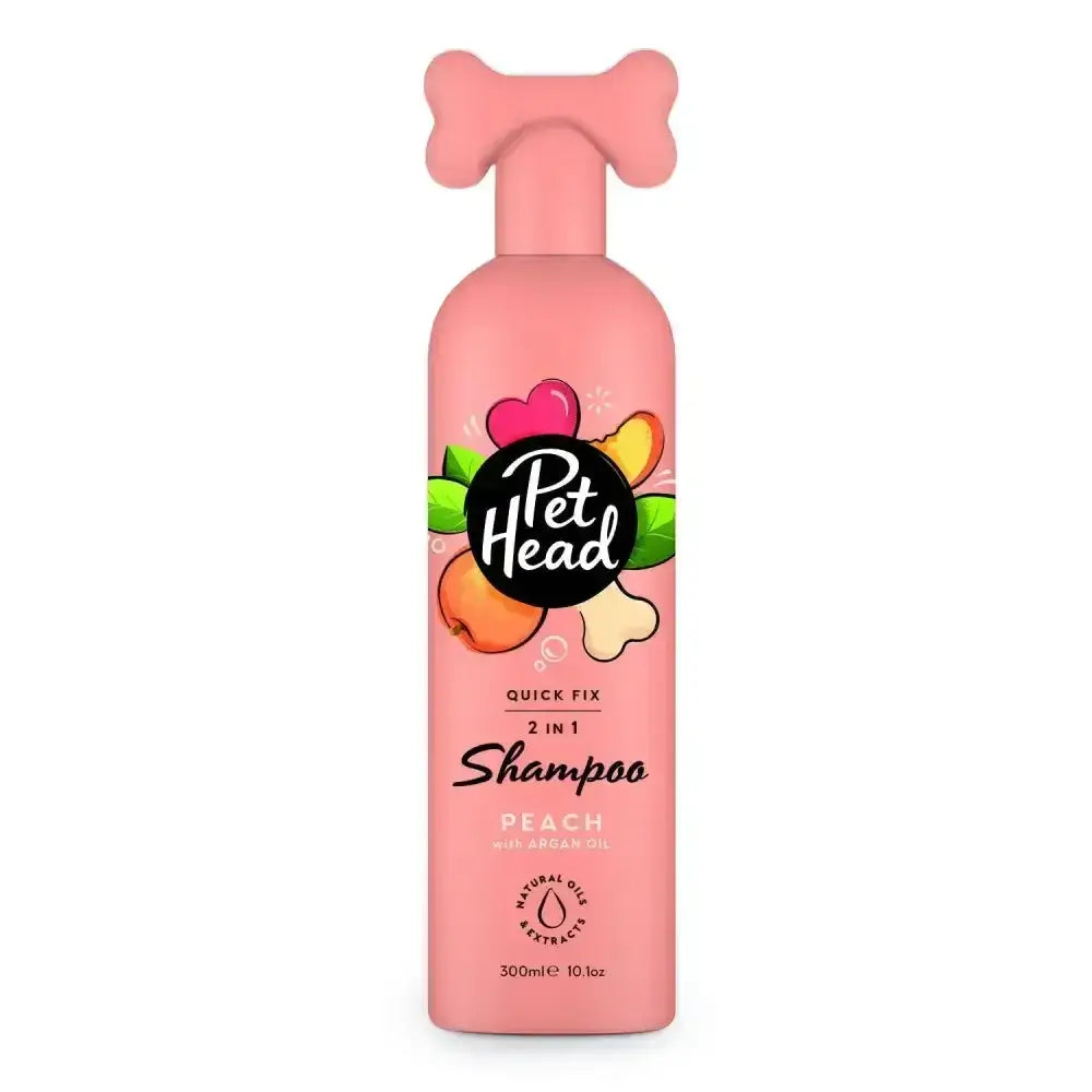Pink pet head quick fix 2-in-1 shampoo bottle with bone-shaped pump and peach-themed label for easy pet grooming