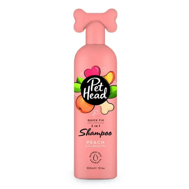 Pink pet head quick fix 2-in-1 shampoo bottle with bone-shaped pump and peach-themed label for easy pet grooming