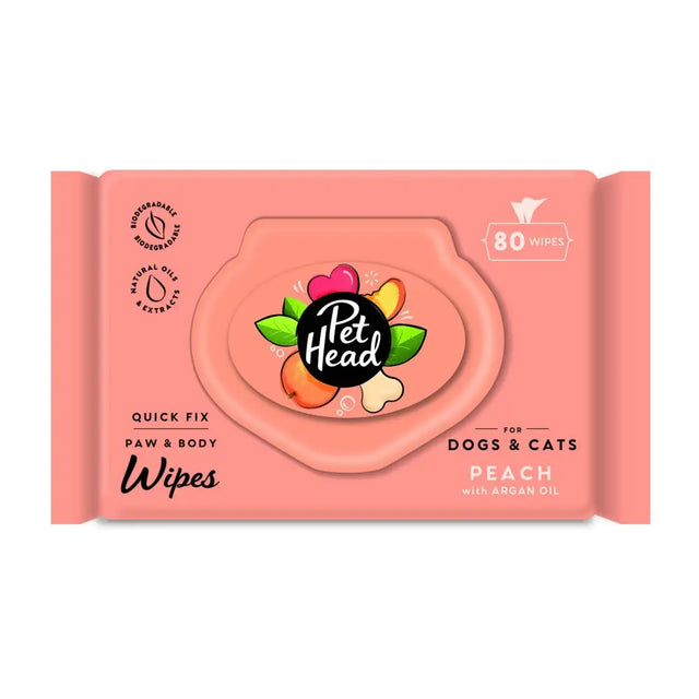 Pink pet head quick fix wipes package with peach scent and colorful fruit design for dogs and cats