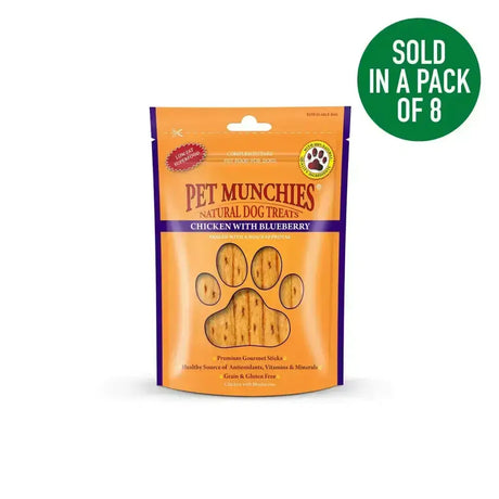 Orange and purple pouch of pet munchies chicken natural dog treats with blueberry flavor for healthy snacking