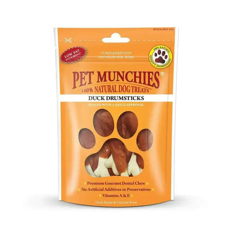 Orange pouch of pet munchies duck drumsticks with clear window showing brown and white gourmet dental stick treats