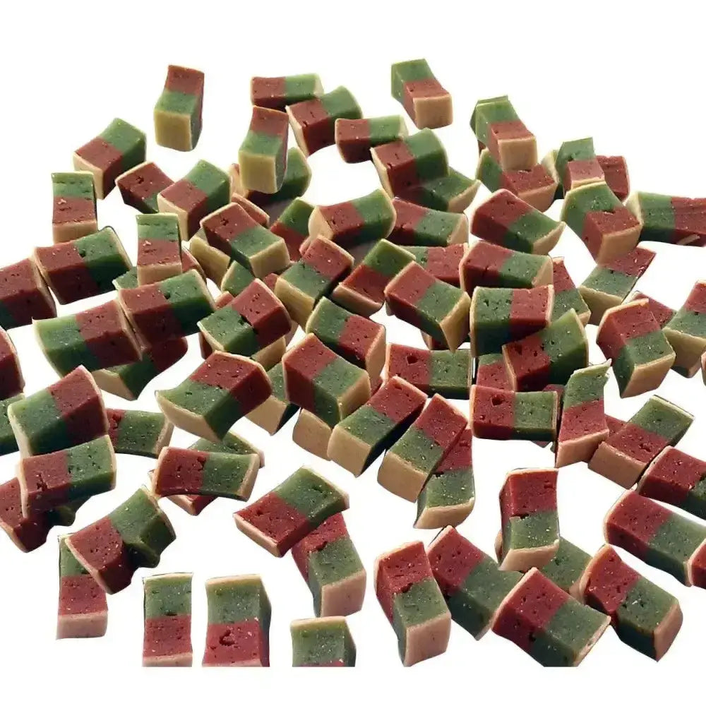 Colorful layered pet munchies training treats sushi with green and red top layer over a beige base for training fun