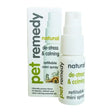 White plastic pet remedy calming spray bottle with green and yellow label featuring valerian essential oil spray nozzle