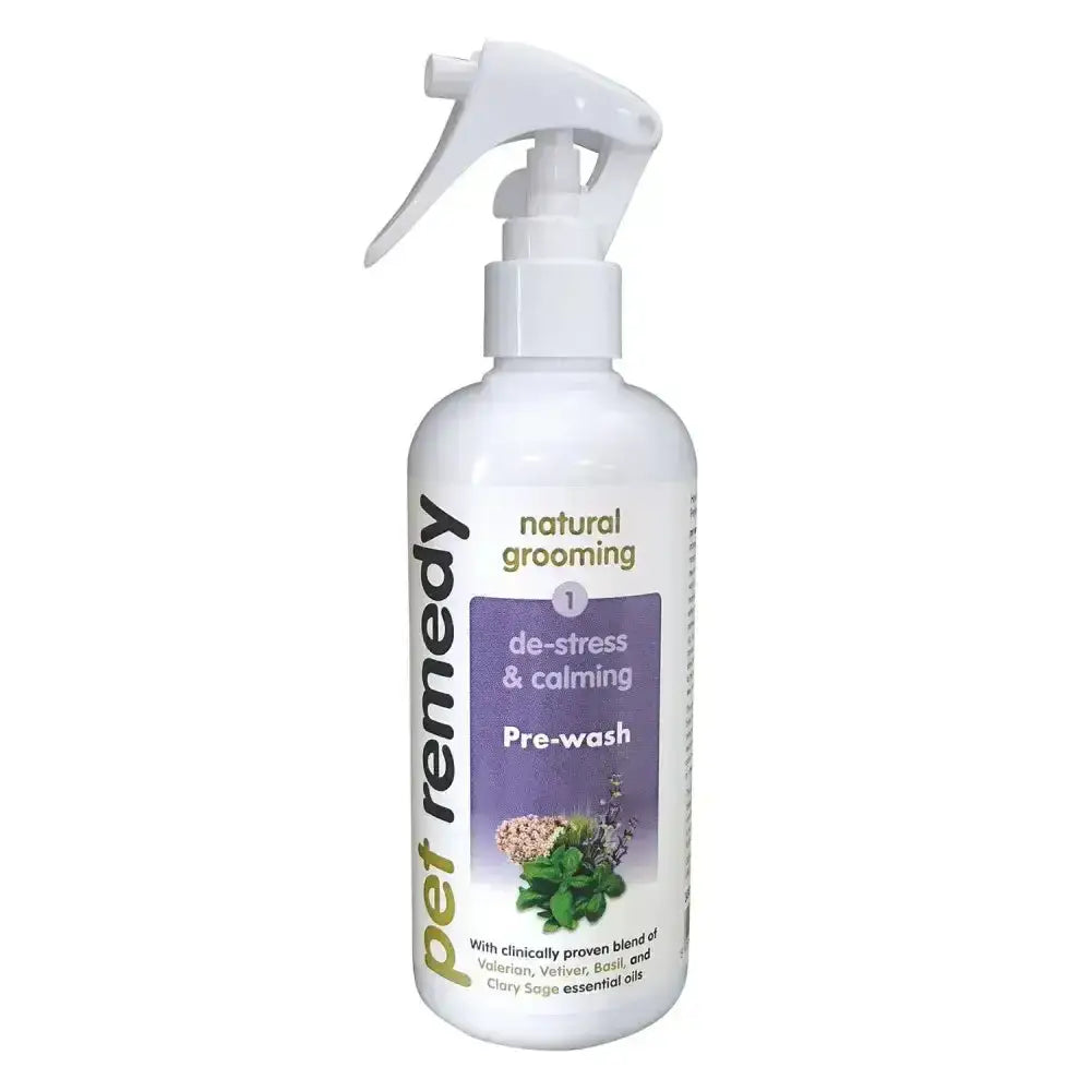 White plastic spray bottle of pet remedy pre-wash with purple green label for effective coconut derived grooming formula