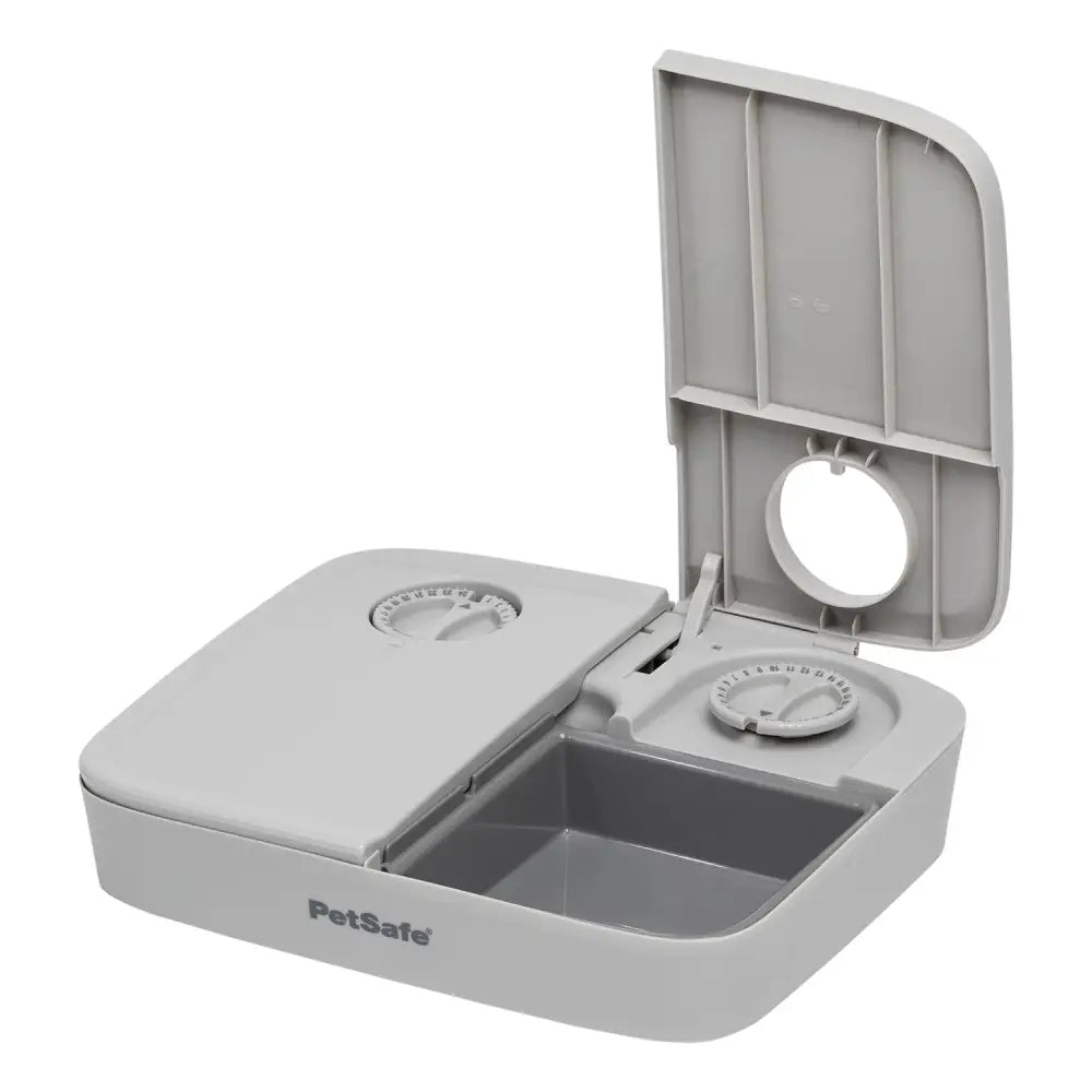 Gray plastic petsafe automatic two meal pet feeder with two compartments and adjustable serving dials for easy feeding