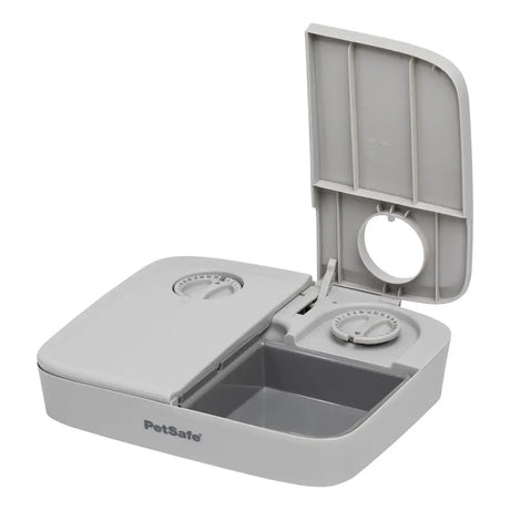 Gray plastic petsafe automatic two meal pet feeder with two compartments and adjustable serving dials for easy feeding