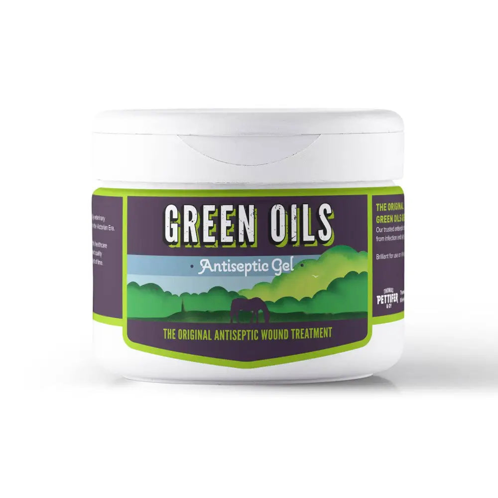 White plastic jar of pettifers green oils gel antiseptic with purple green label showing pastoral scene for equines insect bites